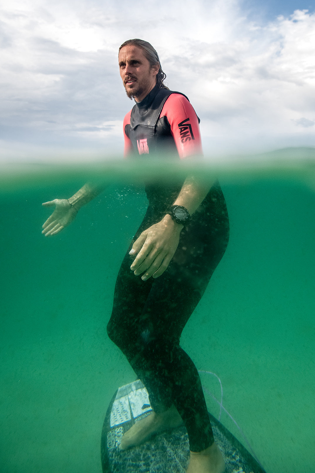 Maxum Basalt Black Digital Watch worn by surfer Kyuss King in the ocean, 